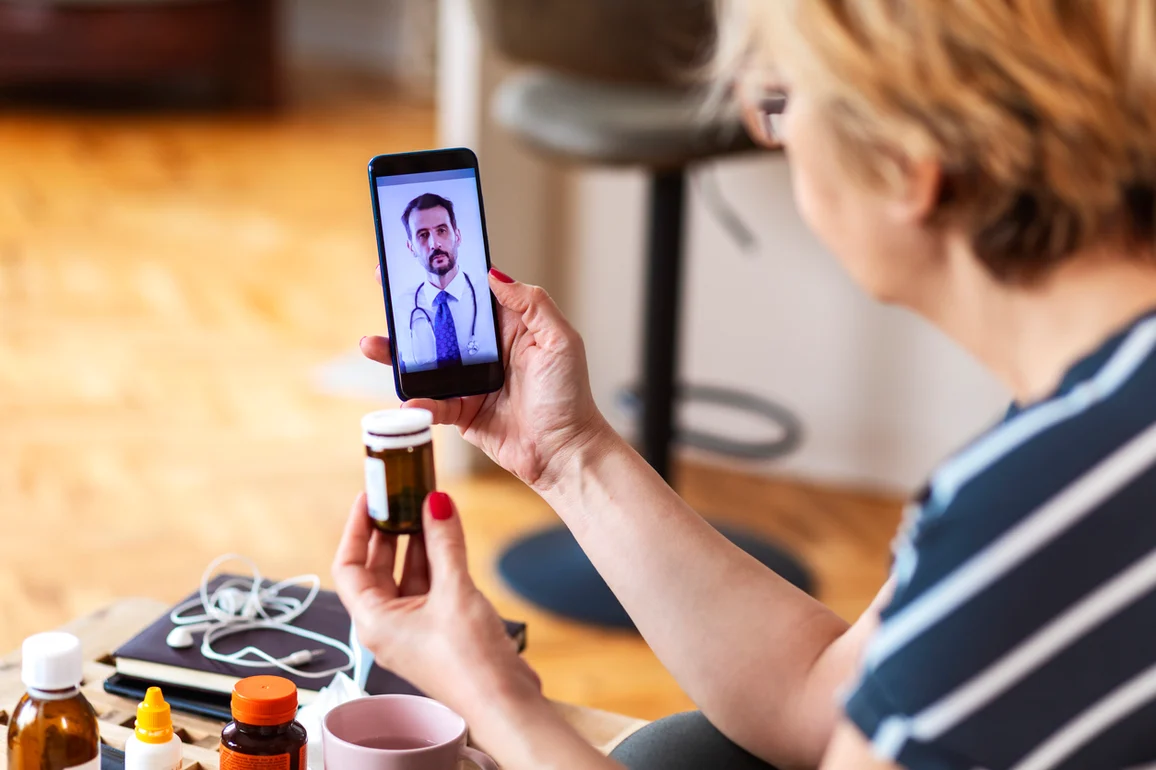 Senior Medicare patient on a telehealth video visit reviewing medications from home in Las Vegas